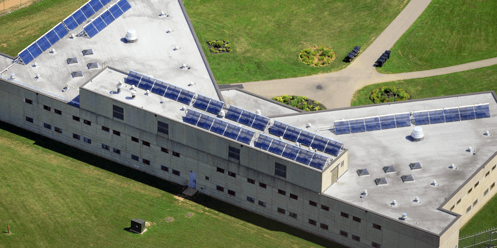 A building with many solar panels on the roof.