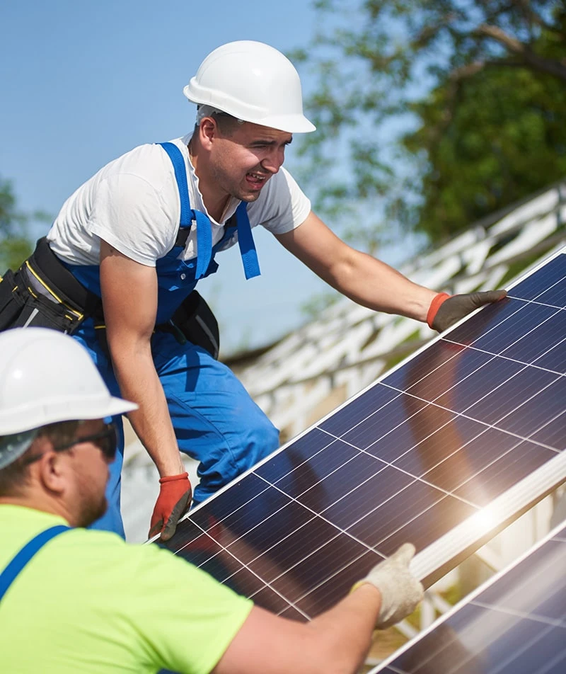 image10 Workers installing solar panels on roof.