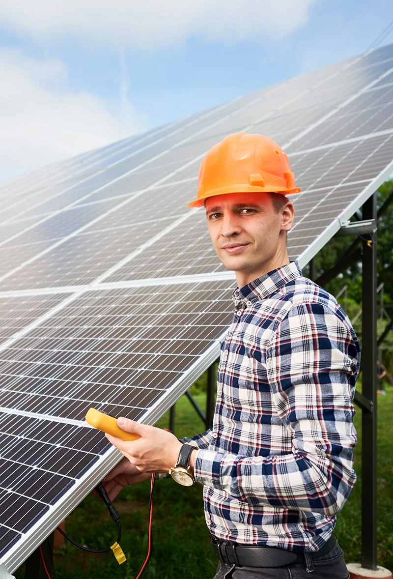 image9 Solar panel technician inspecting array.